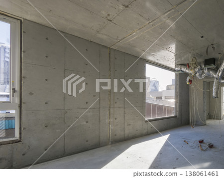 Vacant commercial space with exposed concrete and semi-skeleton state. 138061461