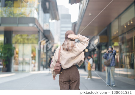 woman traveler travel in Chengdu city. Happy Tourist sightseeing in Taikoo Li Chengdu, located in the Jinjiang District, near the Chunxi Road. Famous landmark for tourism attraction in Sichuan, China woman traveler travel in Chengdu city. Happy Tourist sightseeing in Taikoo Li Chengdu, located in the Jinjiang District, near the Chunxi Road. Famous landmark for tourism attraction in Sichuan, China 138061581