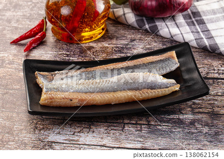 Marinated pickled salted herring fillet 138062154