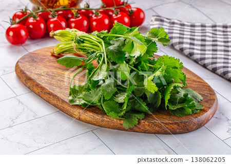 Heap of green fresh coriander stems 138062205