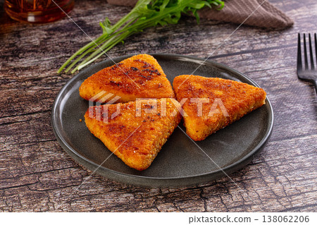Fried golden fish cutlets triangles Fried golden fish cutlets triangles 138062206