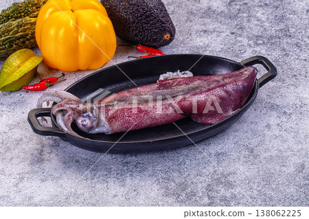Fresh raw squid on a plate with exotic vegetables for cooking Fresh raw squid on a plate with exotic vegetables for cooking 138062225
