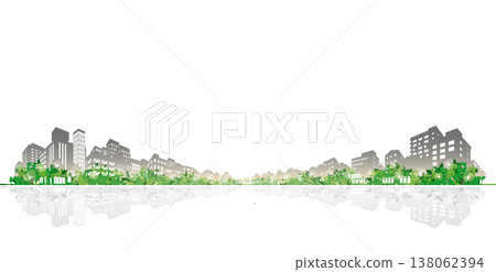 The refreshing greenery of spring and the silhouettes of modern buildings. An early summer urban landscape and an eco-friendly image. 138062394