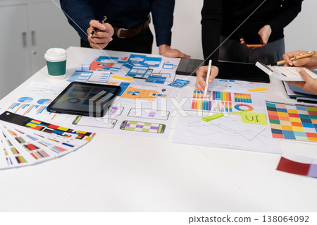 UX developer and ui designer brainstorming about mobile app interface wireframe design with customer breif and color code, User experience concept. UX developer and ui designer brainstorming about mobile app interface wireframe design with customer breif and color code, User experience concept. 138064092