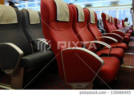 Rows of red and gray reclining passenger seats inside high speed ferry cabin on Hong Kong Macau route Rows of red and gray reclining passenger seats inside high speed ferry cabin on Hong Kong Macau route 138066403