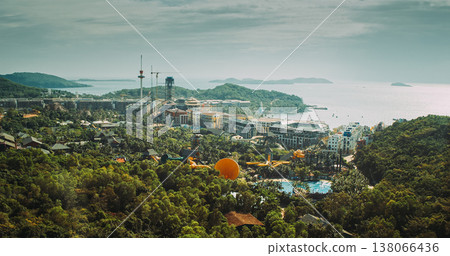 Colorful Mediterranean-style resort buildings on hillside overlooking turquoise sea at Sunset Town, Colorful Mediterranean-style resort buildings on hillside overlooking turquoise sea at Sunset Town, 138066436