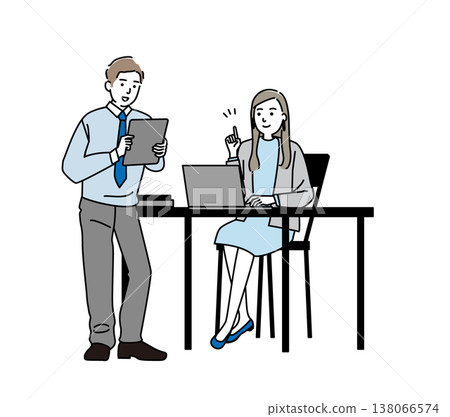 A young businessman talking while operating his computer. A young businessman talking while operating his computer. 138066574