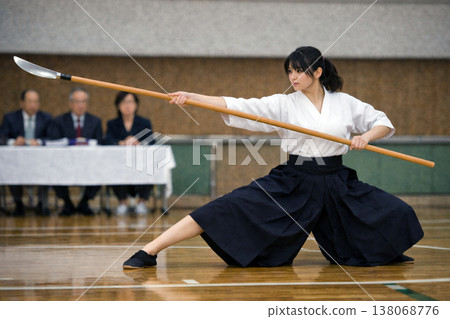 A woman holding Naginata 138068776