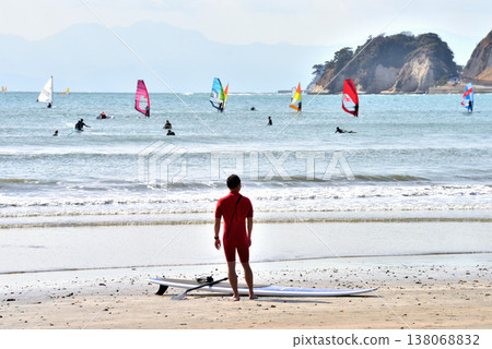 A surfer checks the open sea at Zaimokuza Beach in Kamakura. A surfer checks the open sea at Zaimokuza Beach in Kamakura. 138068832