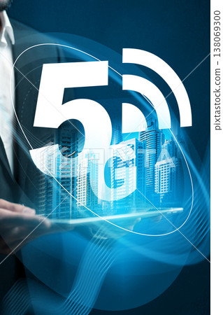 5G internet technology displayed with a city skyline and person using a tablet 5G internet technology displayed with a city skyline and person using a tablet 138069300