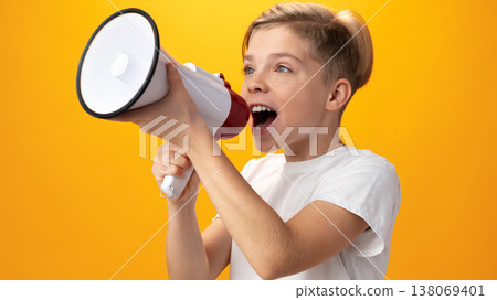 Child with a megaphone speaks out against a bright yellow backdrop Child with a megaphone speaks out against a bright yellow backdrop 138069401