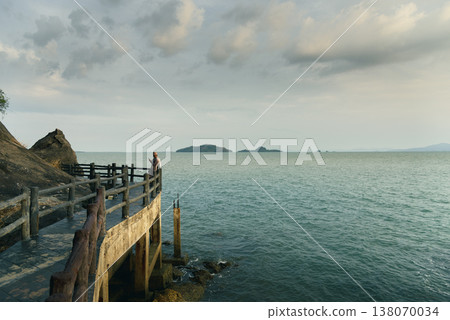 Landscape with sunset at the seashore. sunset sea rock horizon view. Sea rock sunset silhouette. Sunset sea rock and mountain range. Nature background Landscape with sunset at the seashore. sunset sea rock horizon view. Sea rock sunset silhouette. Sunset sea rock and mountain range. Nature background 138070034