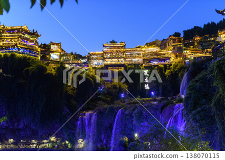 Furong Town, CHINA - OCTOBER 21th, 2023: Furong Ancient Town illuminated at night. Amazing beautiful landscape scene of Furong Ancient Town (Furong Zhen, Hibiscus Town), China. 138070115