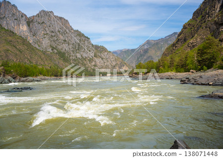 Yelandinsky rapid on the Katun river in Altai Russia. Powerful mountain stream crashing over rocks in famous rafting destination. Yelandinsky rapid on the Katun river in Altai Russia. Powerful mountain stream crashing over rocks in famous rafting destination. 138071448
