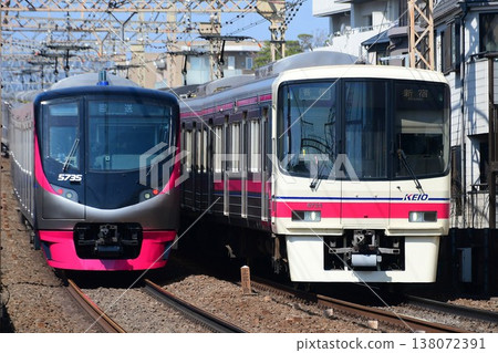 Keio 5000 series 5735F and 8000 series 8733F passing each other. Keio 5000 series 5735F and 8000 series 8733F passing each other. 138072391