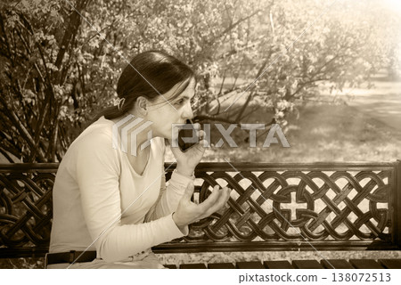 Young girl speaking by phone Young girl speaking by phone 138072513