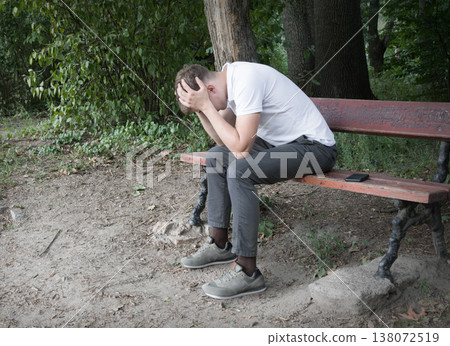 Sad guy on the park bench Sad guy on the park bench 138072519