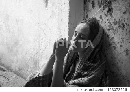 Poor young girl prayint to God Poor young girl prayint to God 138072526
