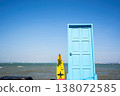 Blue Door and Surfboard by the Sea 138072585