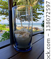 Glass vase with seashells by the beach 138072597