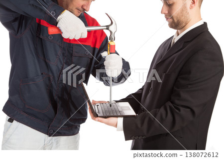 Fixing a laptop with a screwdriver. Fixing a laptop with a screwdriver. 138072612