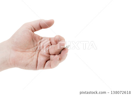 A man's hand is juggling a coin. A man's hand is juggling a coin. 138072618
