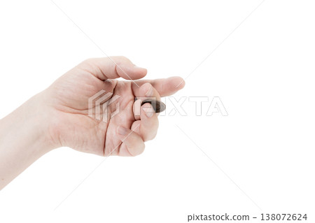 A man's hand is juggling a coin. A man's hand is juggling a coin. 138072624