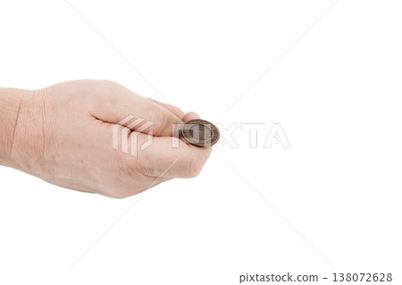 A man's hand holding coins. A man's hand holding coins. 138072628