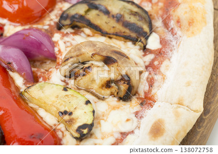 Vegetable pizza on a wooden tray. 138072758