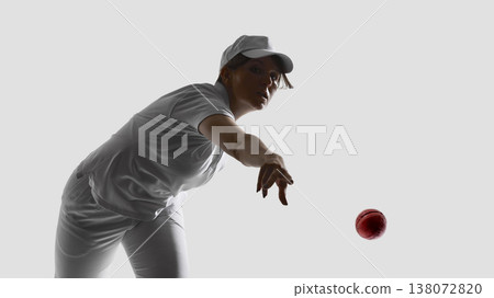 Female cricket player releasing ball in motion isolated on white background. Female cricket player releasing ball in motion isolated on white background. 138072820