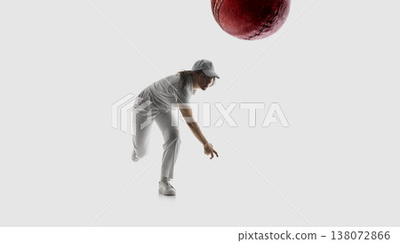Female cricket player bowling ball action shot isolated on white background. Female cricket player bowling ball action shot isolated on white background. 138072866
