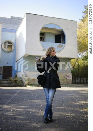 A young woman walks through the autumn park. A young woman walks through the autumn park. 138072989