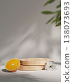 Podium with sliced orange and floral accents. 3D render illustration 138073693