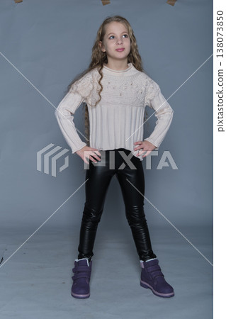A joyful child poses with a wide smile, exuding excitement and enthusiasm. The vibrant energy of this portrait captures the essence of a carefree spirit, making it suitable for themes of motivation A joyful child poses with a wide smile, exuding excitement and enthusiasm. The vibrant energy of this portrait captures the essence of a carefree spirit, making it suitable for themes of motivation 138073850