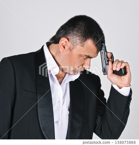 Serious man with gun Serious man with gun 138073868