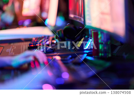 Competitive Gaming Setup With RGB Monitors, Keyboard And Mouse In Neon LAN Tournament Environment Competitive Gaming Setup With RGB Monitors, Keyboard And Mouse In Neon LAN Tournament Environment 138074508