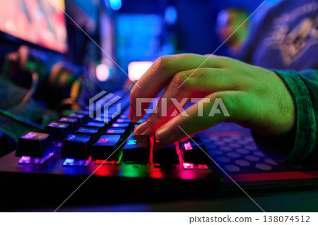 Close-Up Of Gamer Hands On RGB Mechanical Keyboard In Neon Gaming Setup For Esports Play Close-Up Of Gamer Hands On RGB Mechanical Keyboard In Neon Gaming Setup For Esports Play 138074512