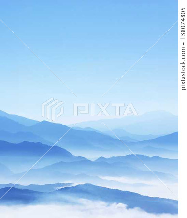 A mountain range shrouded in mist, like a fantastical ink painting. A mountain range shrouded in mist, like a fantastical ink painting. 138074805
