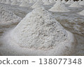 Salt fields in Phetchaburi Province, Thailand, where salt is harvested from seawater using traditional methods. 138077348