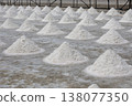 Salt fields in Phetchaburi Province, Thailand, where salt is harvested from seawater using traditional methods. 138077350