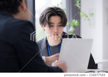 Business image of face-to-face interviews such as job interviews and career counseling. 138077583