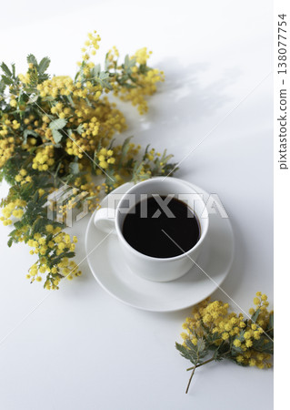A vibrant spring table photo featuring mimosa and coffee. Copy space available. 138077754