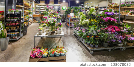 Berlin, Germany - August 09, 2025: Colorful flower shop interior with vibrant blooms and fresh arrangements 138078083