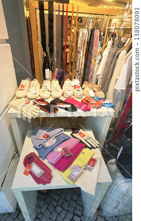 Berlin, Germany - August 18, 2025: Colorful gloves and shoes displayed in boutique shop Berlin, Germany - August 18, 2025: Colorful gloves and shoes displayed in boutique shop 138078091