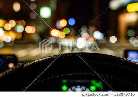 The night cityscape viewed from the driver's seat, with its fantastical bokeh effect. The night cityscape viewed from the driver's seat, with its fantastical bokeh effect. 138079710