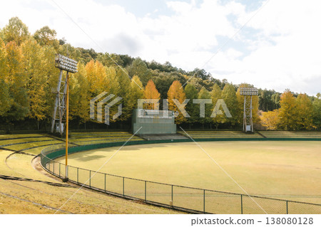 A deserted baseball field and scoreboard bathed in autumn colors. A deserted baseball field and scoreboard bathed in autumn colors. 138080128