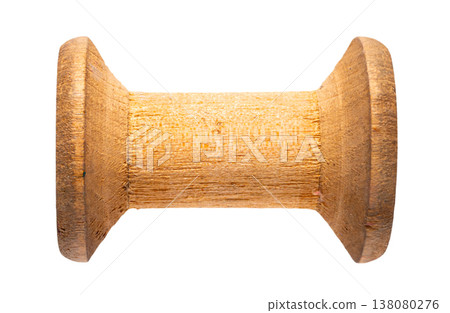 empty wooden sewing spool on white isolated background 138080276