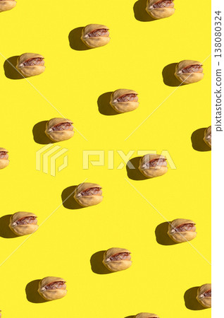 Pistachio pattern on yellow background, colorful flat lay food texture top view Pistachio pattern on yellow background, colorful flat lay food texture top view 138080324