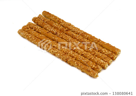 Crunchy sesame breadsticks isolated on white background 138080641