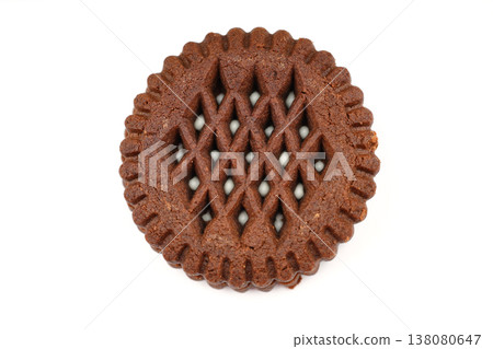Round chocolate sandwich cookie with white cream filling isolated on white background Round chocolate sandwich cookie with white cream filling isolated on white background 138080647